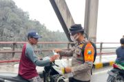 Mount Semeru eruption: Police hand out masks as ash covers key route