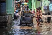 Rising seas, land subsidence put Jakarta at critical risk: minister