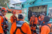 Bali search team deploys helicopter to burning ferry