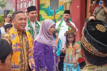 Minister encourages fathers' involvement for children's resilience