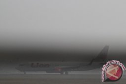 BANDARA DISELIMUTI KABUT ASAP