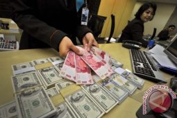Nilai Tukar Rupiah Turun 15 Poin Menjadi Rp12.990