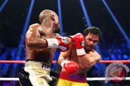 Jual Beli Serangan Minim, Mayweather Menang Angka