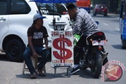 Dolar Melemah Tertekan Prospek Penundaan Kenaikan Suku Bunga