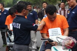 REKONSTRUKSI ANGGOTA BRIMOB DI BEGAL