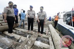 AMANKAN KAYU ILEGAL