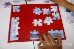 Permainan Puzzle dari Uang