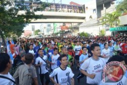 Agus Prayogo Raih Juara 10 K Depok