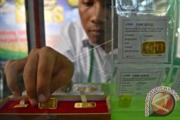 Emas Turun Setelah Saham dan Dolar AS Menguat