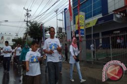 Jalan Sehat "BUMN Hadir Untuk Negeri" Semarak Meski Diguyur Hujan