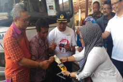 Mandiri Permudah Pembayaran Penumpang Bus Bandara Juanda