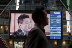 Saham Singapura berakhir naik tipis
