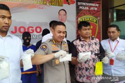 East Java police arrest two armed drug dealers