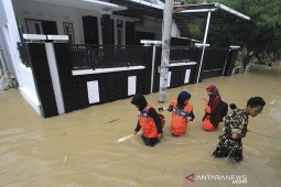 Banjir akibat tanggul jebol