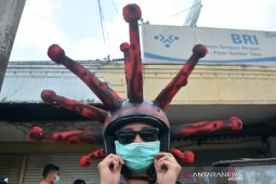 Cara Unik Sosialisasi Penggunaan Masker