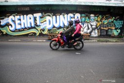 Sosialisasi COVID-19 melalui mural