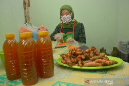 Produksi Minuman Kunyit Asam