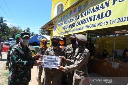 Pangdam Merdeka salurkan paket lebaran ke petugas kesehatan perbatasan Atinggola
