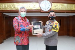 Cegah penyebaran COVID-19, Polda Jatim dan BI sosialisasikan pembayaran nontunai