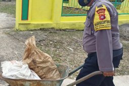 Sinergitas TNI- POLRI dalam pelasanaan  TMMD  Regtas ke-110 di Pengkadan