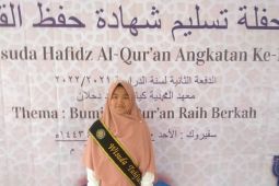 Amelia Siregar anak wartawan wisuda hafidz Alquran