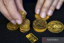 Harga emas naik  akibat melemahnya dolar