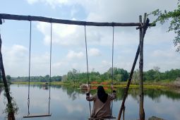 Wisata "Ngabuburit" di Danau Letang Muarabulian