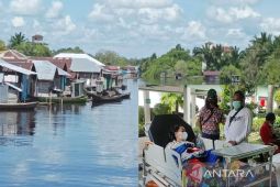 Seorang wanita selamat dari terkaman buaya setelah sempat ditarik ke dalam sungai