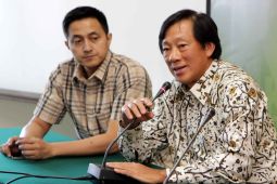 Justian Suhandinata seorang organisator bulu tangkis kelas dunia