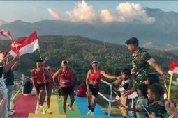 Yonif 751/VJS lari membawa Bendera Merah Putih sejauh 80 Km
