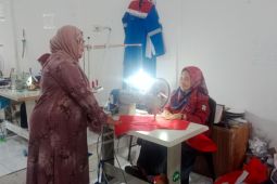 Kisah Suci Sustari dan jahitan baju tahan api