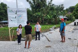 PLN salurkan bantuan pembangunan jalan Desa Tempang Dua Minahasa