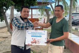 BNCT dan Kodaeral I dalam kegiatan penyaluran hewan kurban di Belawan