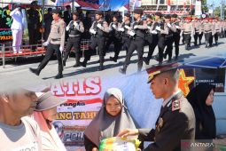 HUT Bhayangkara, Polres Tanjungbalai gelar defile dan berbagi beras gratis
