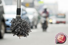 Cairan Ban Anti Ranjau Paku