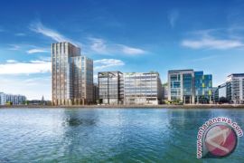 Kennedy Wilson announces sale of 130,000 sq ft office building to J.P. Morgan as first occupier at its capital dock development