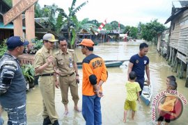 MENINJAU LOKASI DAERAH BANJIR