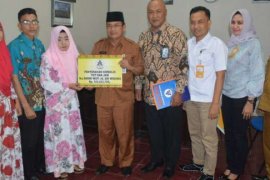 Pemda dan PT.Taspen Serahkan Santunan Jaminan Kematian Kepada Ahli Waris