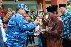 Api Asian Games menyeberangi sungai terpanjang di Sumatera