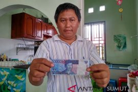 Waspda uang palsu beredar