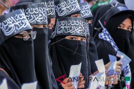 AKSI PROTES PEMBAKARAN BENDERA BERKALIMAH TAUHID