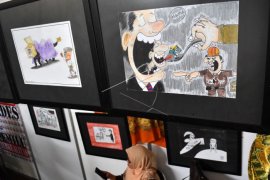 Pameran kartun tentang pengawasan pemilu