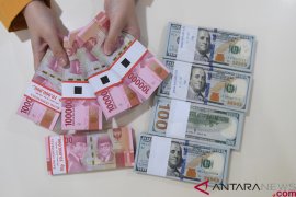 Rupiah rises 180 points to close at Rp14,090 per dollar