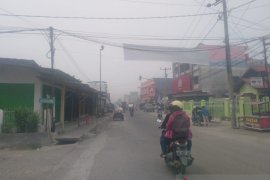 Hujan turun, kabut asap masih selimuti tiga daerah di Sumut