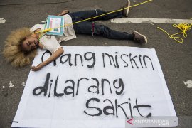 Aksi teaterikal jaminan kesehatan