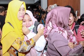 Kedatangan WNI dari Observasi di Natuna