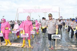 S Kalimantan police spread thousands of mangroves seeds at Pagatan Besar Beach