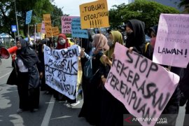 unjukrasa memperingati Hari Perempuan Internasional