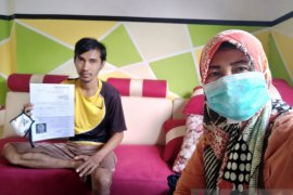 Pandemi COVID-19 tak halangi Indah lakukan tugas sebagai kader JKN-KIS