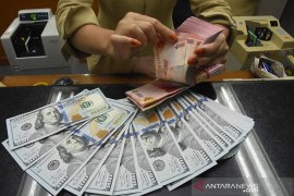 Rupiah melemah seiring ekspektasi membaiknya ekonomi Amerika Serikat